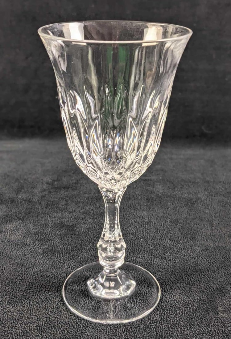 Retired Fostoria Crystal Kimberly Wine Glass: Fostoria Crystal Kimberly Wine Glass. This design was released from 1979 to 1982. Glass is approx 3 1/8" x 3 1/8" x 6 1/2" and is in a good, vintage condition with no known damage.