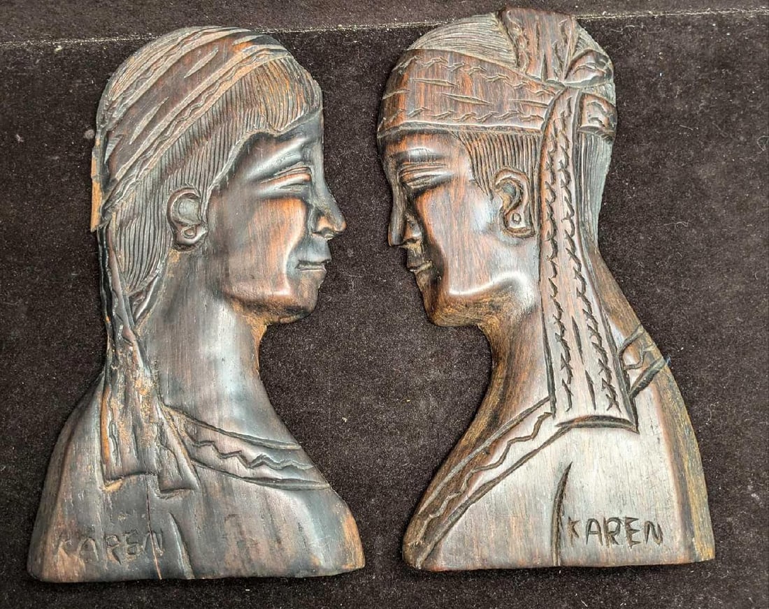 2 Hand Carved Karen Hindu Style Folk Art Relief Teak Wall Art: 2 Hand Carved Karen Hindu Style Folk Art Relief Teak Wall Art. Each is approx 5 1/4" x 3/4" x 9 7/8" and the total weight is 1.73lb. One has some chips on the back of the head. Please see the images a