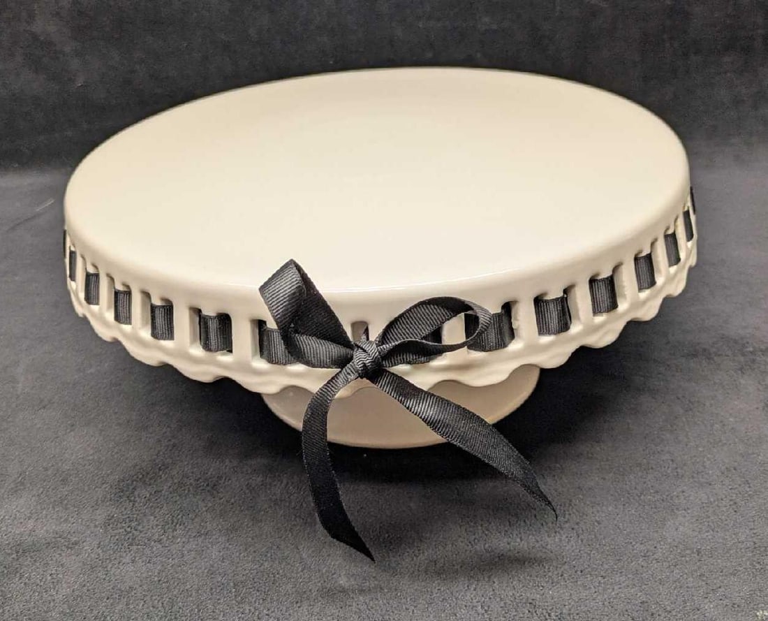 Grace's Teaware White Pedestal Plate Stand With Ribbon: Grace's Teaware White Pedestal Plate Stand With Ribbon. This is approx 10 1/2" x 10 1/2" x 4 1/2" and it weighs 2.60lbs. The ceramic stand has no chips or cracks. The bottom of the base has some wear