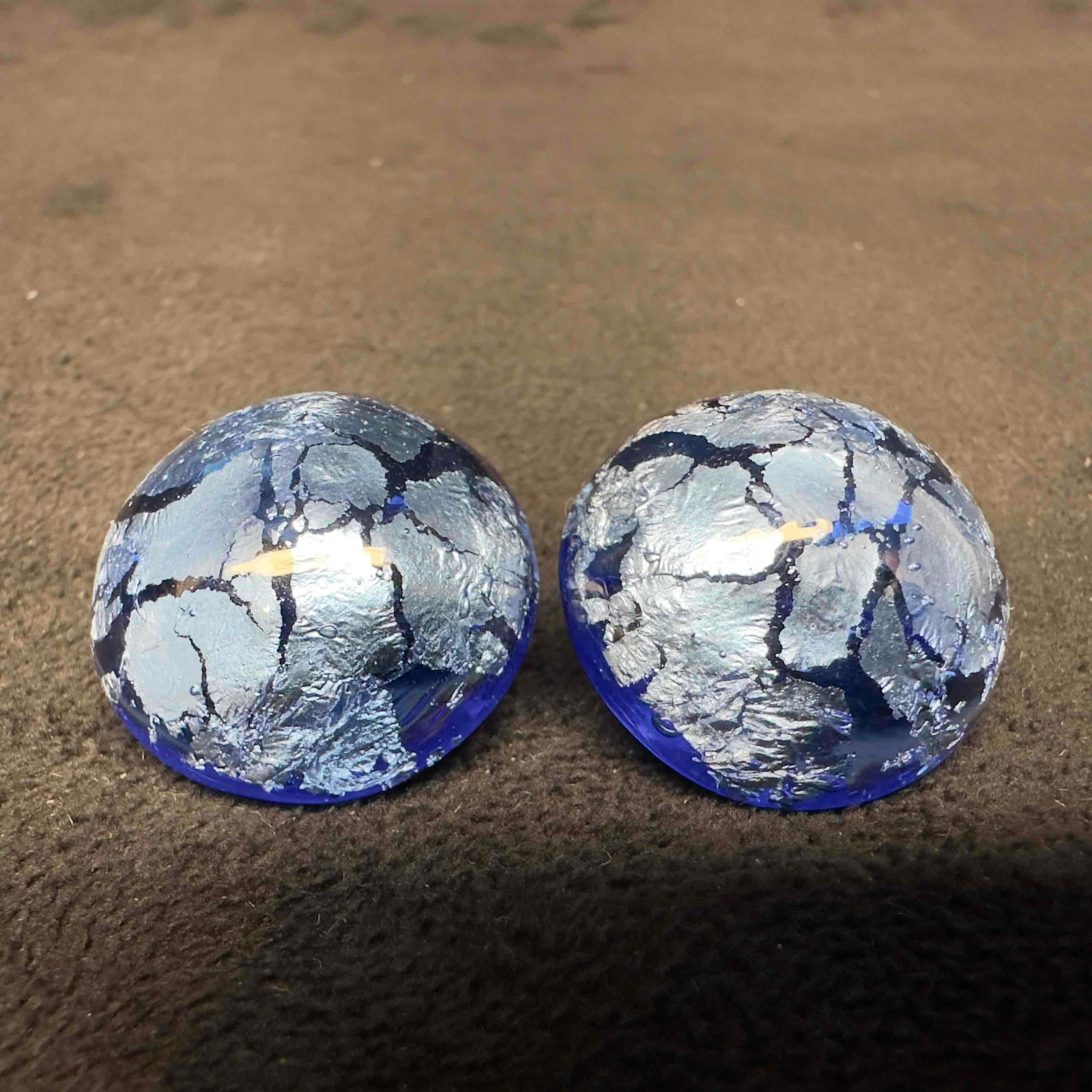 Blue Glass Silver Colored Foil Bead Round Earrings H46: Blue Glass Silver Colored Foil Bead Round Earrings H46. Earrings with blue glass beads with beautiful designs on each. The earrings feature silver colored foil accents. The earrings feature a