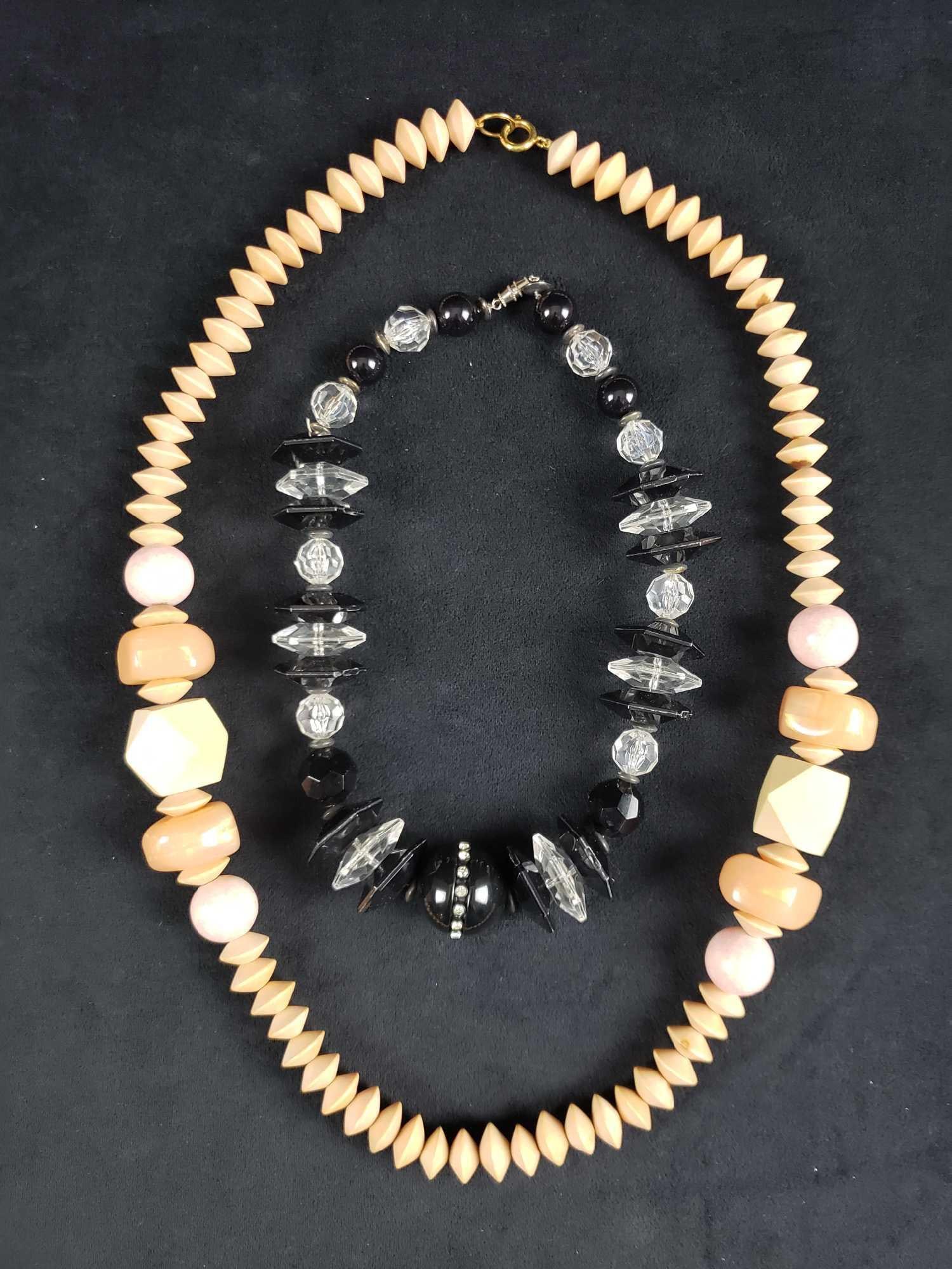 Eye Catching Wood and Plastic Bead Necklaces: Eye Catching Wood and Plastic Bead Necklaces. This set of 2 necklaces is in good to great used condition. The items in this set are: 1 wood and plastic bead necklace. No known signs of obvious damage