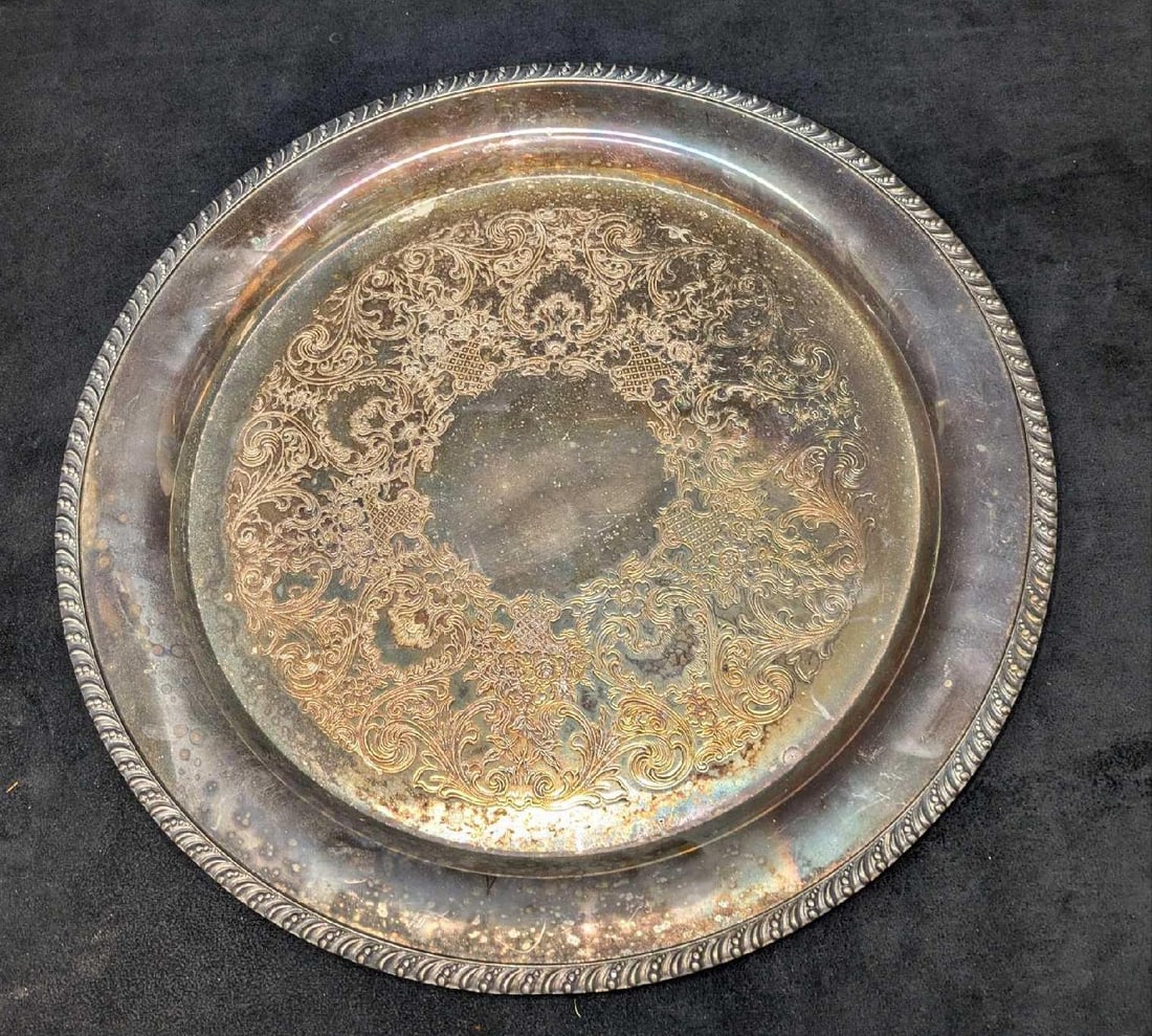 Vintage V.M. Rogers Silver Plated 15" Serving Platter: Vintage V.M. Rogers Silver Plated 15" Serving Platter. This is approx 15" x 15" x 1 3/4" and it weighs 2.60lbs. There is some surface tarnish and light scratches.