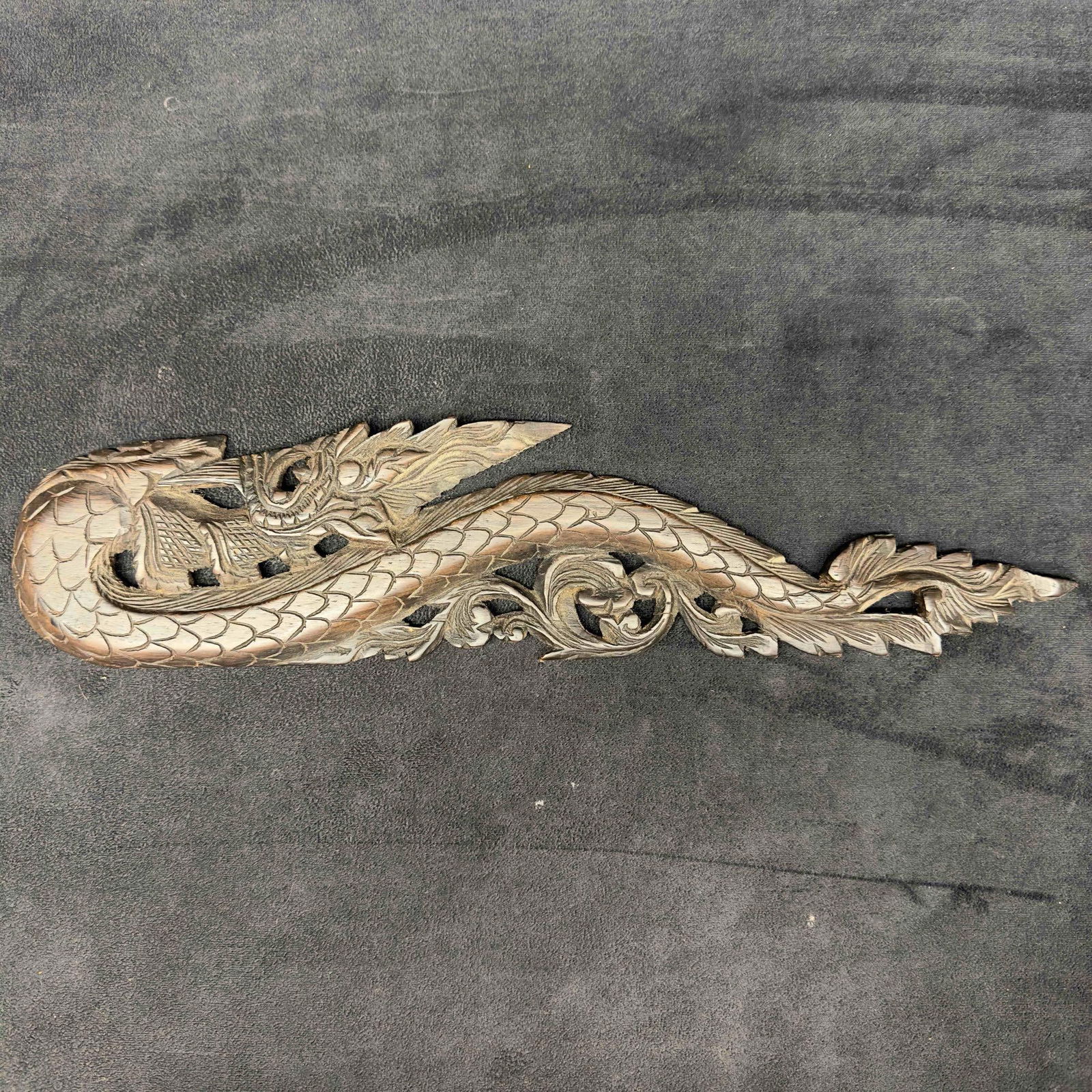 Carved Wooden Dragon Wall Plaque Wood Art Decor: Carved Wooden Dragon Wall Plaque Wood Art Decor. This hand carved wooden dragon wall art features a detail design. No initial markings to identify age and maker. The wood is a dark brown in color.