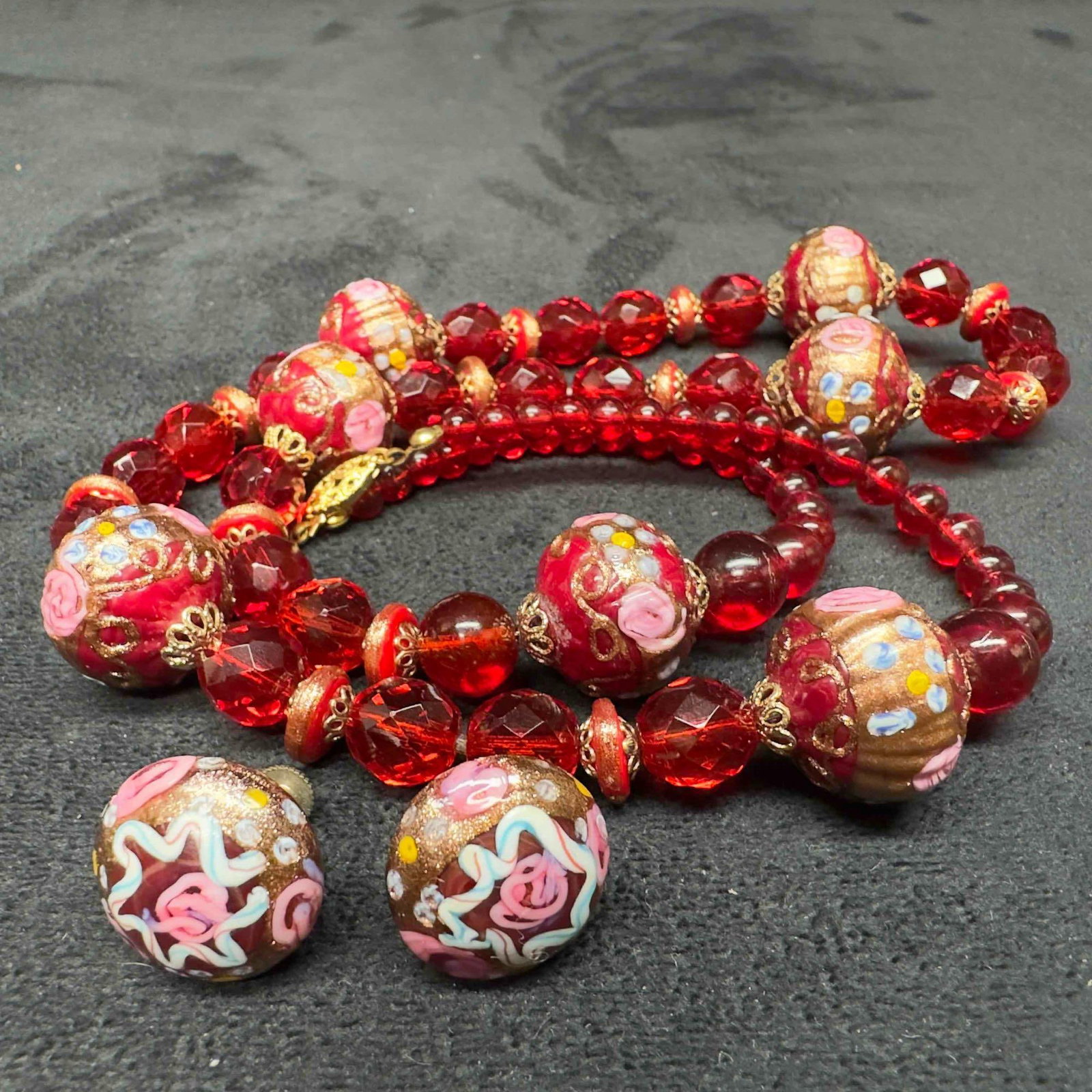 Venetian Murano Lamp Work Glass Red Fiorato Bead Round Beaded Necklace and Earrings Set B23: Venetian Murano Lamp Work Glass Red Fiorato Bead Round Beaded Necklace and Earrings Set B23. Necklace and earrings with red colored glass beads with beautiful hand painted designs on each. The