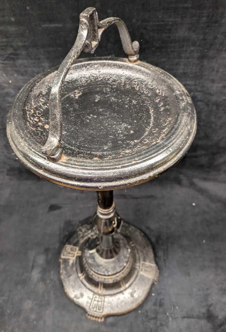 Vintage Black Metal Traditional Ashtray: Vintage Black Metal Traditional Ashtray. The bottom is made of a heavy cast iron metal, while the rest is a light metal. The ashtray has some paint loss and light surface rust. The middle is loose