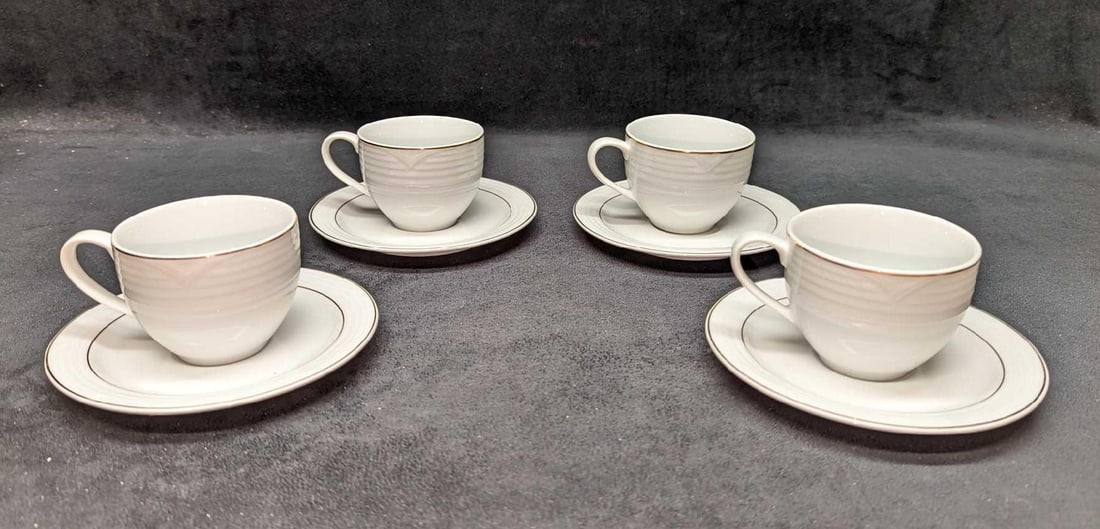 4 Arctic Gold Noritake Flat Cup & Saucer Sets: 4 Arctic Gold Noritake Flat Cup & Saucer Sets. This series of fine china was released from the year 1996 to the year 2001. This lot includes: (4) Flat Cups. Each is approx 4 1/4" x 3 1/4"