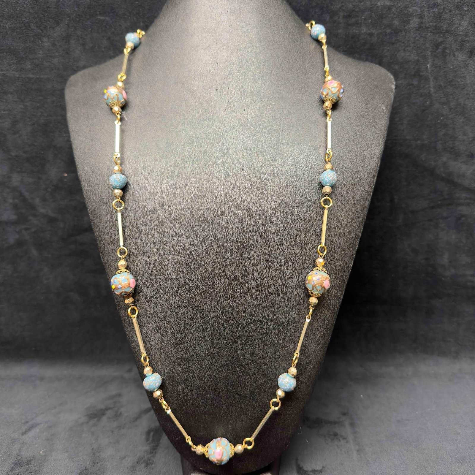Murano Venetian Art Glass Lamp Work Light Blue Beaded Floral Fiorato Necklace C18: Murano Venetian Art Glass Lamp Work Light Blue Beaded Floral Fiorato Necklace C18. Necklace with light blue glass beads with beautiful designs on each. The necklace features silver toned accents. The