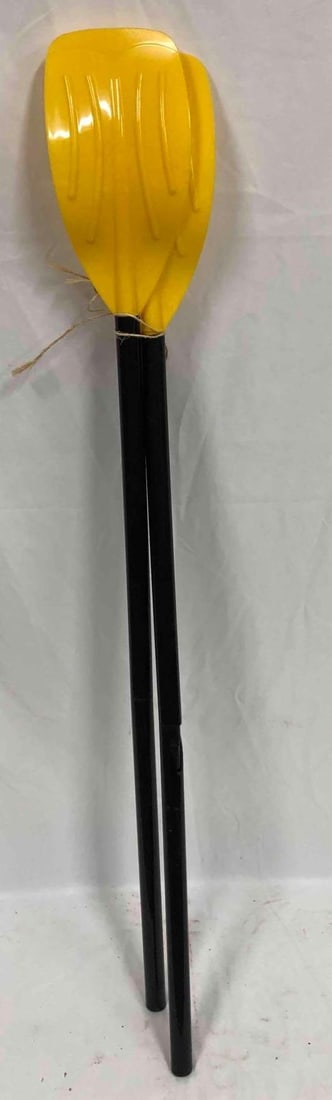 2 Plastic Kayak Paddles: This lot contains two plastic black and yellow kayak paddles. Perfect for any lake or beach house. Each paddle is approx 48 1/2" x 5 3/4" and together they weigh about 2.1lbs. The paddles are in good