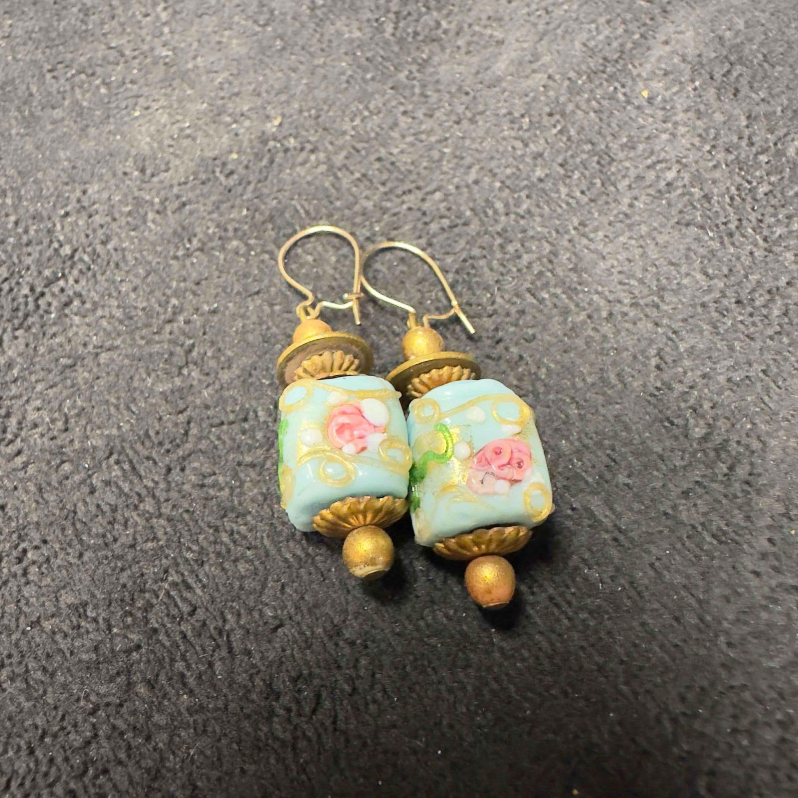 Murano Venetian Art Glass Lamp Work Light Blue Floral Accents Bead Dangle Earrings F82: Murano Venetian Art Glass Lamp Work Light Blue Floral Accents Bead Dangle Earrings F82. Earrings with light blue colored glass beads with beautiful designs on each. The earrings feature floral accents