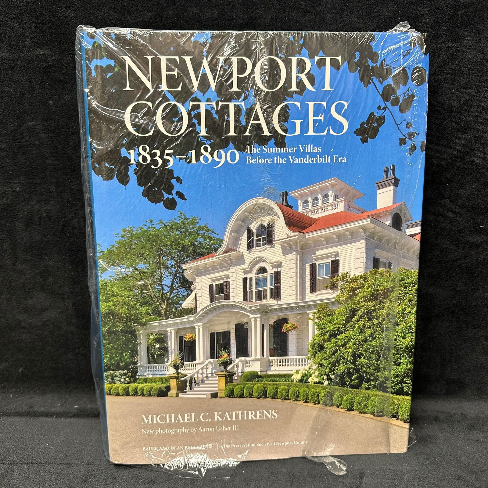 Newport Cottages 1835-1890 The Summer Villas Before the Vanderbilt Era by Michael C. Kathrens Book: Sealed hardcover copy of Newport Cottages 1835–1890 by Michael C. Kathrens, featuring new photography by Aaron Usher III. Book remains in original shrink wrap with some tearing to the plastic from s
