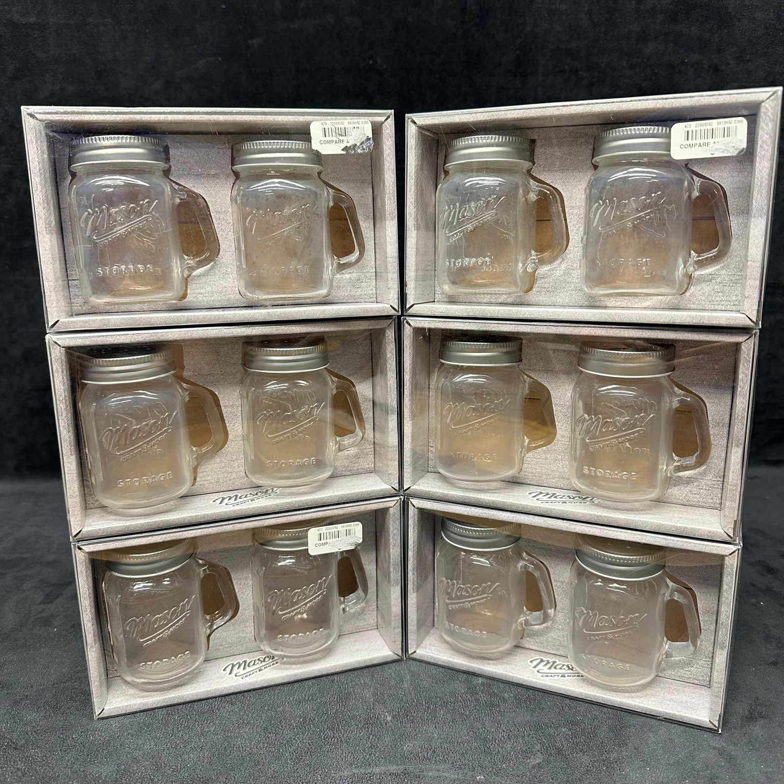 Mason Craft and More Glass Mason Jar Salt and Pepper Shaker Sets New: Lot includes six boxed pairs of Mason Craft and More glass salt and pepper shakers, each designed in the classic mini Mason jar style with handle and screw-top lid. Durable glass construction with