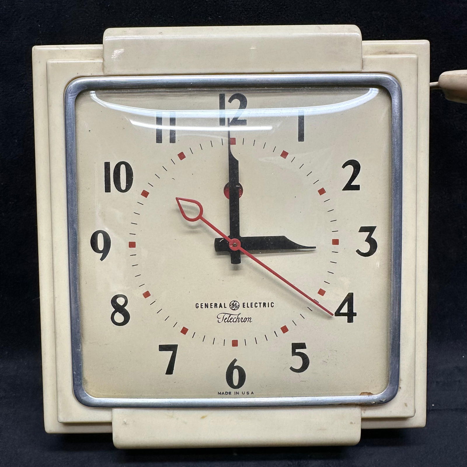 General Electric Telechron Model 2H25 Electric Wall Clock Mid Century Modern: Vintage General Electric Telechron electric wall clock, model 2H25, featuring a square cream-colored case with silver-tone bezel, black Arabic numerals, and red sweep second hand. Marked General Elect