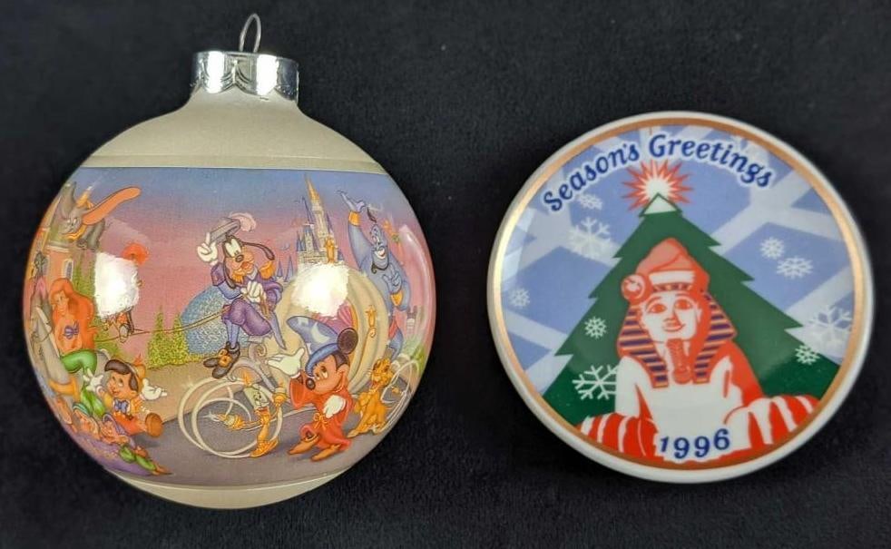 Disney 25th Anniversary And Sphinx Ornament Lot: Disney 25th Anniversary And Sphinx Ornament Lot. This lot includes one Walt Disney World 25th Anniversary Glass Ball Christmas Ornament. This measures approx 3" x 3" x 4" and it comes in its orig