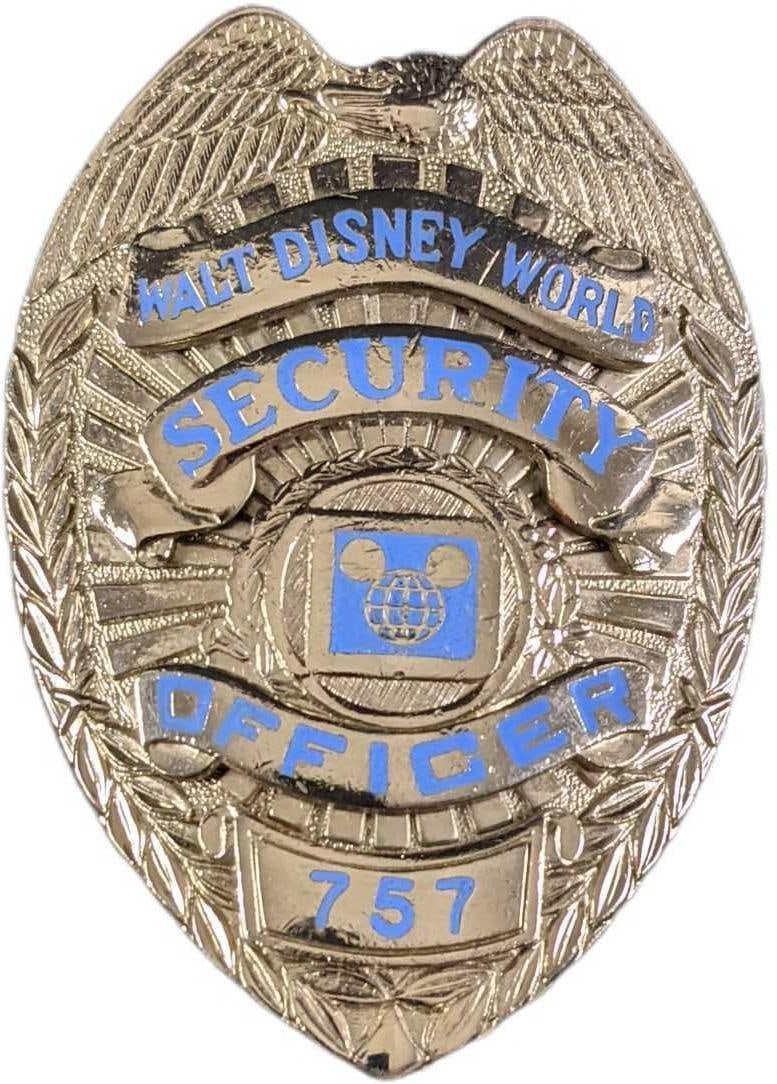 Early 1980s Disney World Security Metal Badge: Early 1980s Disney World Security Metal Badge. Is approx 2 1/4" x 3/4" x 3" and it weighs under one pound at 0.16lb. The metal badge is in a good, vintage condition with some wear and mini scratches