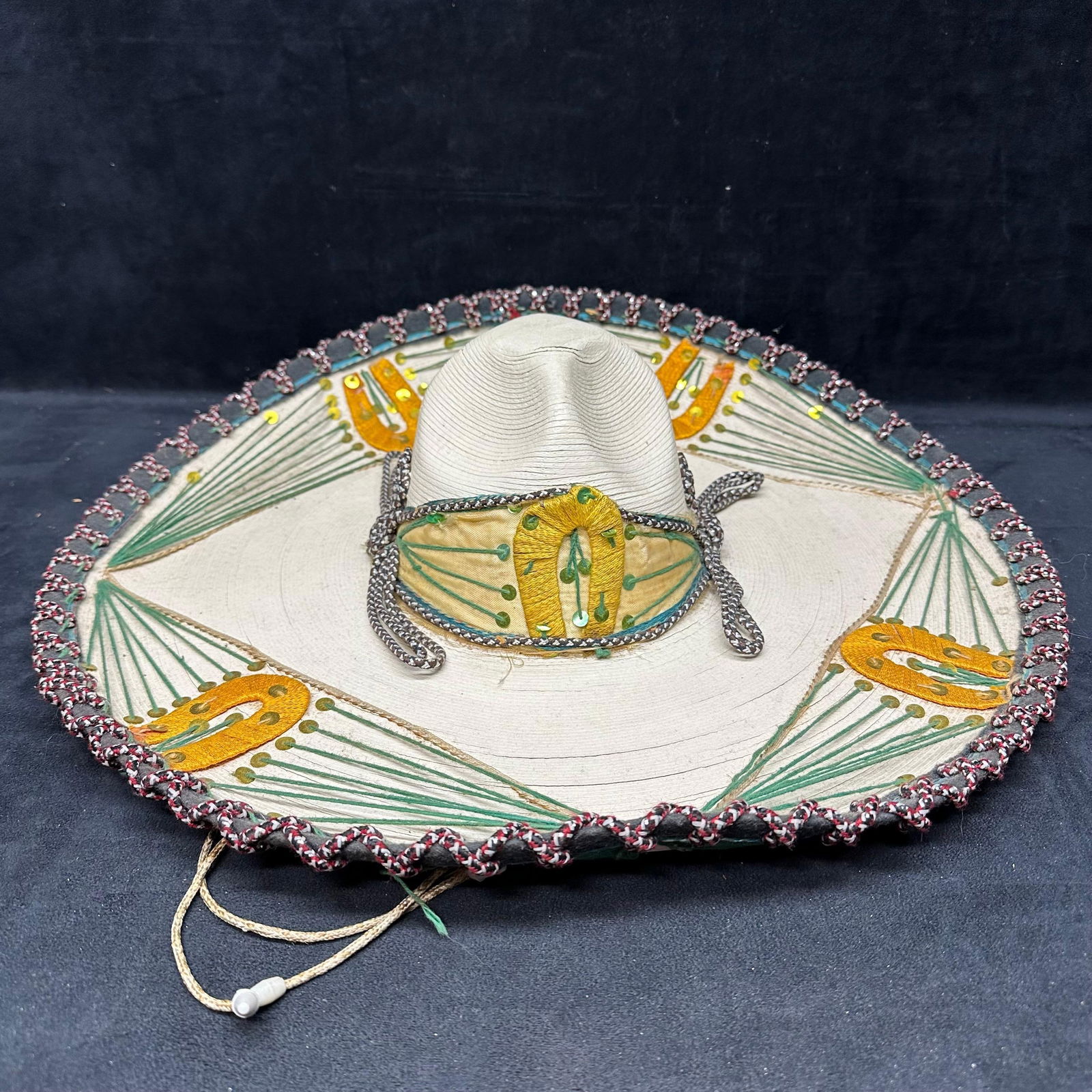 Mexican Straw Sombrero Hat Embroidery and Sequin Decoration Hecho en Mexico: Traditional Mexican straw sombrero featuring decorative embroidery, sequins, and cordwork along the brim. The natural woven straw body is accented with green thread fan patterns and gold tone