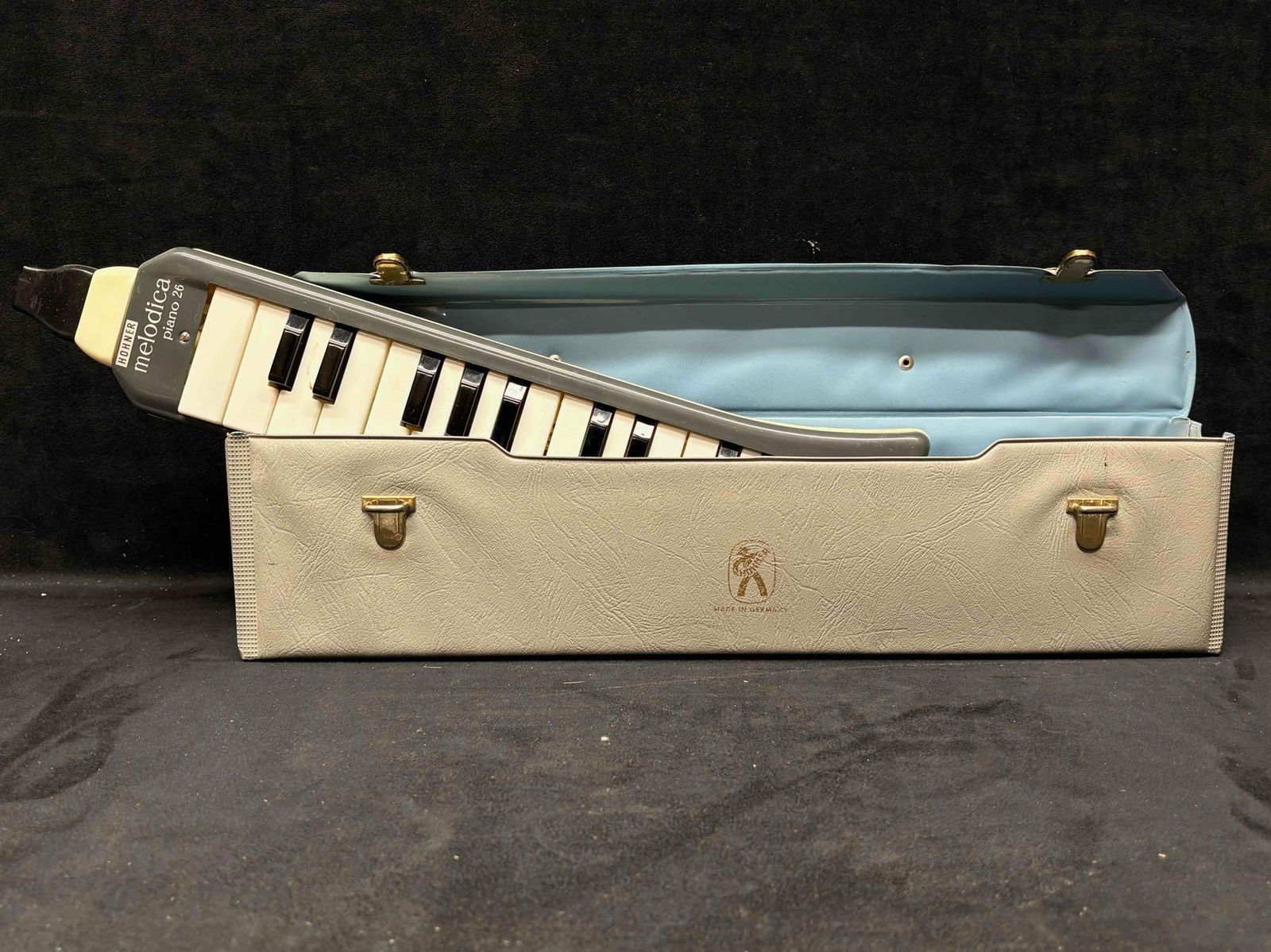1960s Hohner Melodica Piano 26: Featuring 26 keys and its original case, this lot is a vintage Hohner Melodica. Hohner, a German instrument company, manufactured this instrument intended to produces an accordion like sound when
