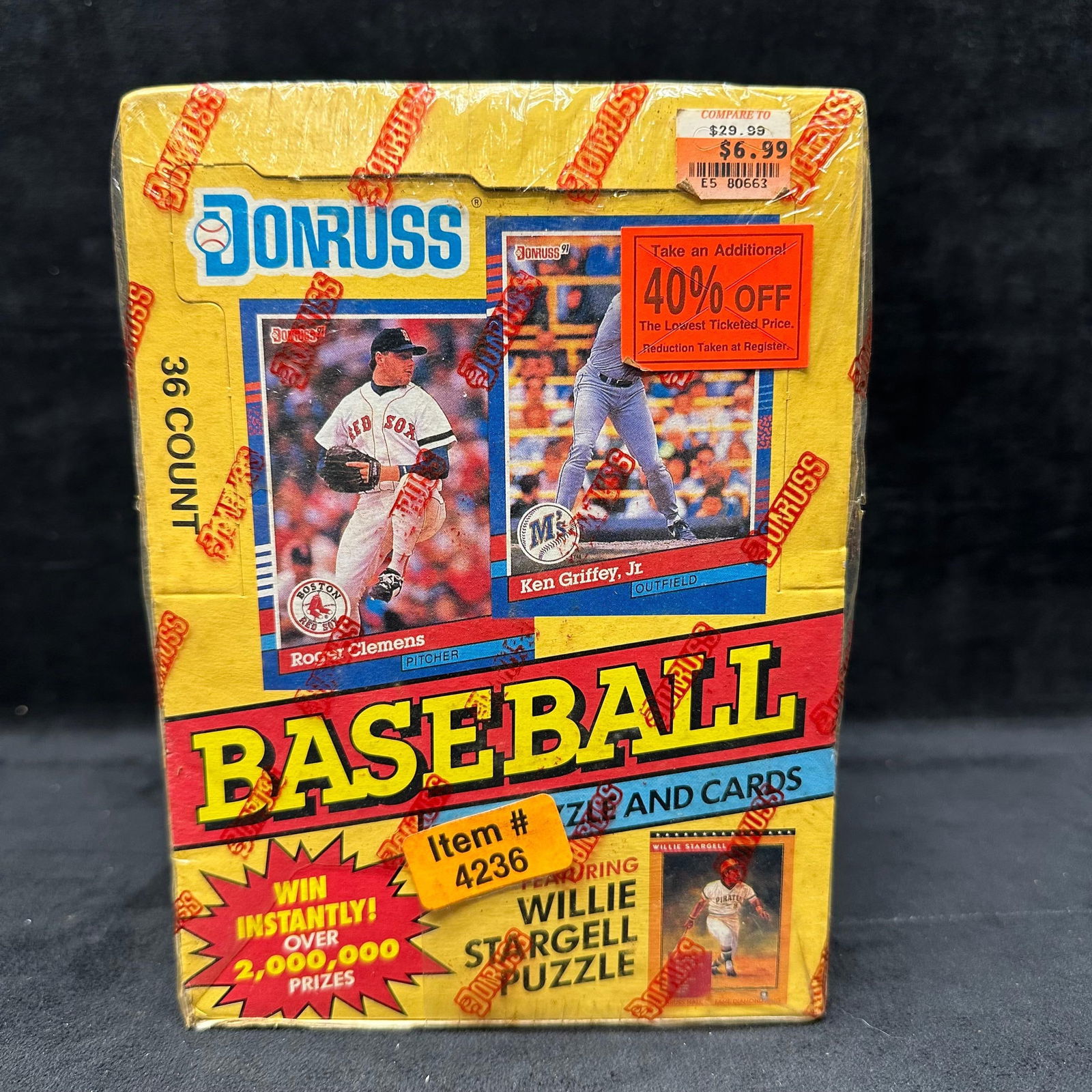 1991 Donruss Series 1 Baseball Wax Box Sealed 36 Packs: The factory-sealed box originally contains 36 factory packs. Packaging shows heavy shelf wear, creasing, and edge damage, with sealed plastic. This item is in like-new, previously displayed condition