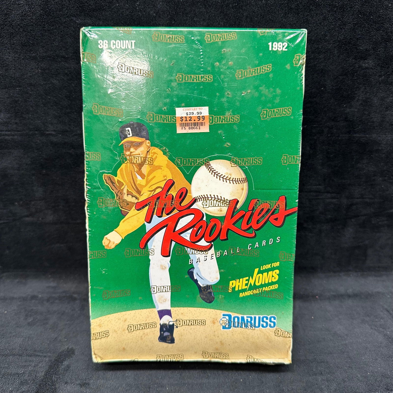 1990s Donruss The Rookies Baseball Card Hobby Box 36 Packs: The box originally contains 36 factory packs. Packaging shows heavy shelf wear, creasing, and edge damage, with sealed plastic. This item is in like-new, previously displayed condition with normal lig