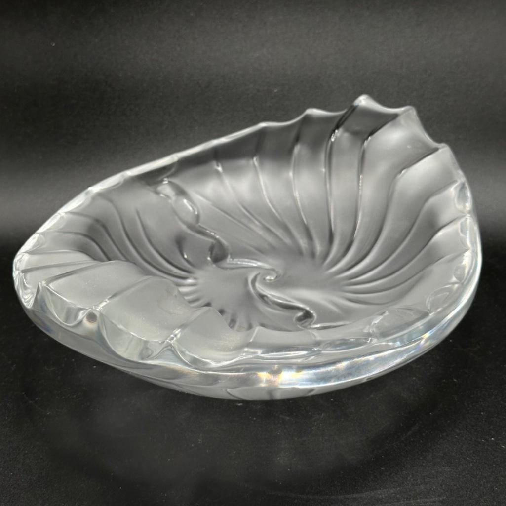 Lalique Nancy Ashtray: Lalique Nancy Ashtray Nancy pattern ashtray by Lalique, in clear crystal with their signature frosted texture. The ashtray stands approximately 2.5" tall, 8" to 7" in diameter, and weighs