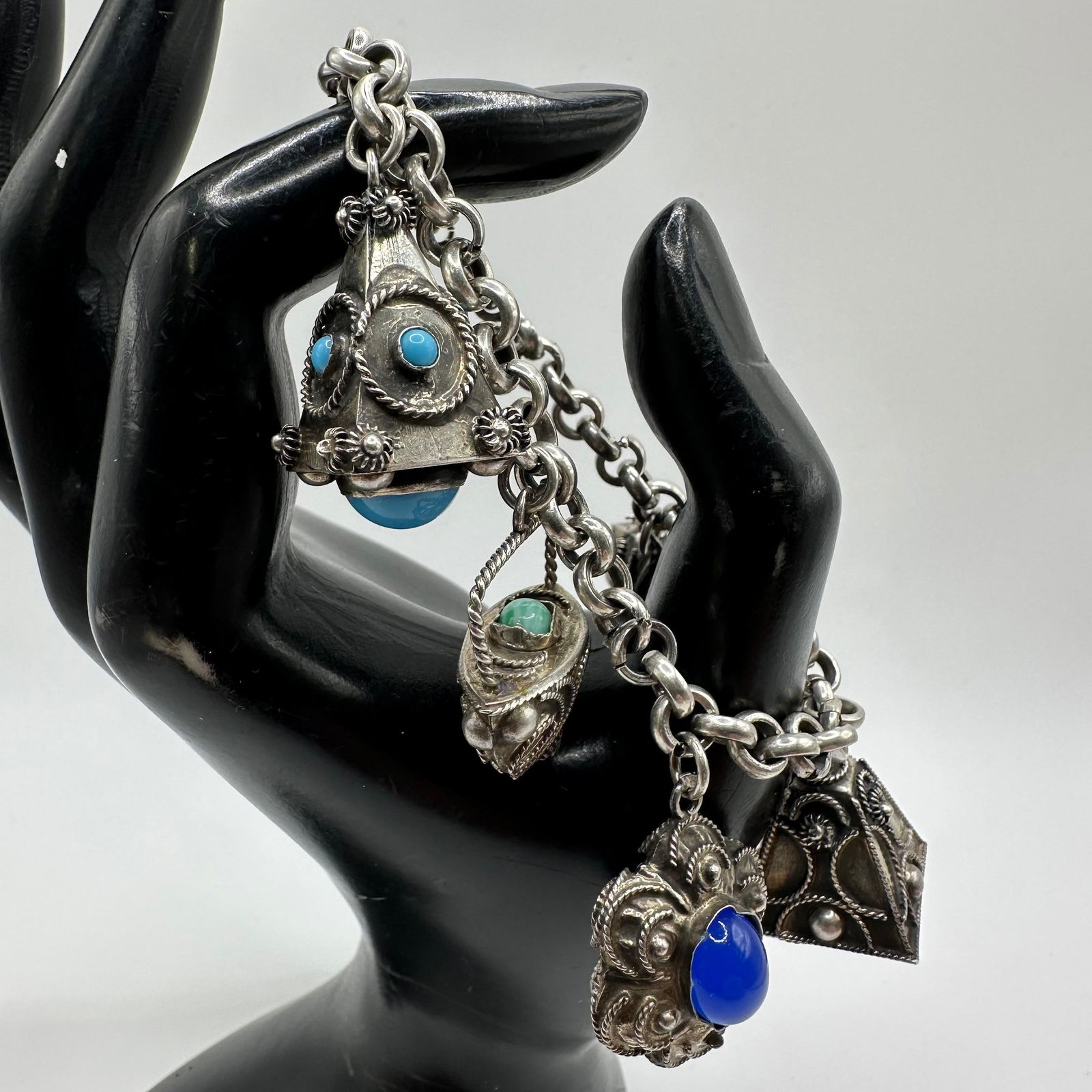 Italian Etruscan Revival Charm Bracelet 800 Silver X52: This item is in good pre-owned, previously used/displayed condition with noticeable light wear and surface scratches. Please reference all photos for full details. This piece of jewelry has been teste