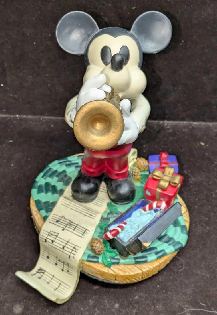 Disney Mickey Mouse Stocking Holder Season Of Song: Disney Mickey Mouse Stocking Holder Season Of Song. This resin figure is approx 7" x 5 1/2" x 6" and it weighs 2.20lbs. There appears to be some glue/repair work on the top of the case with the candy