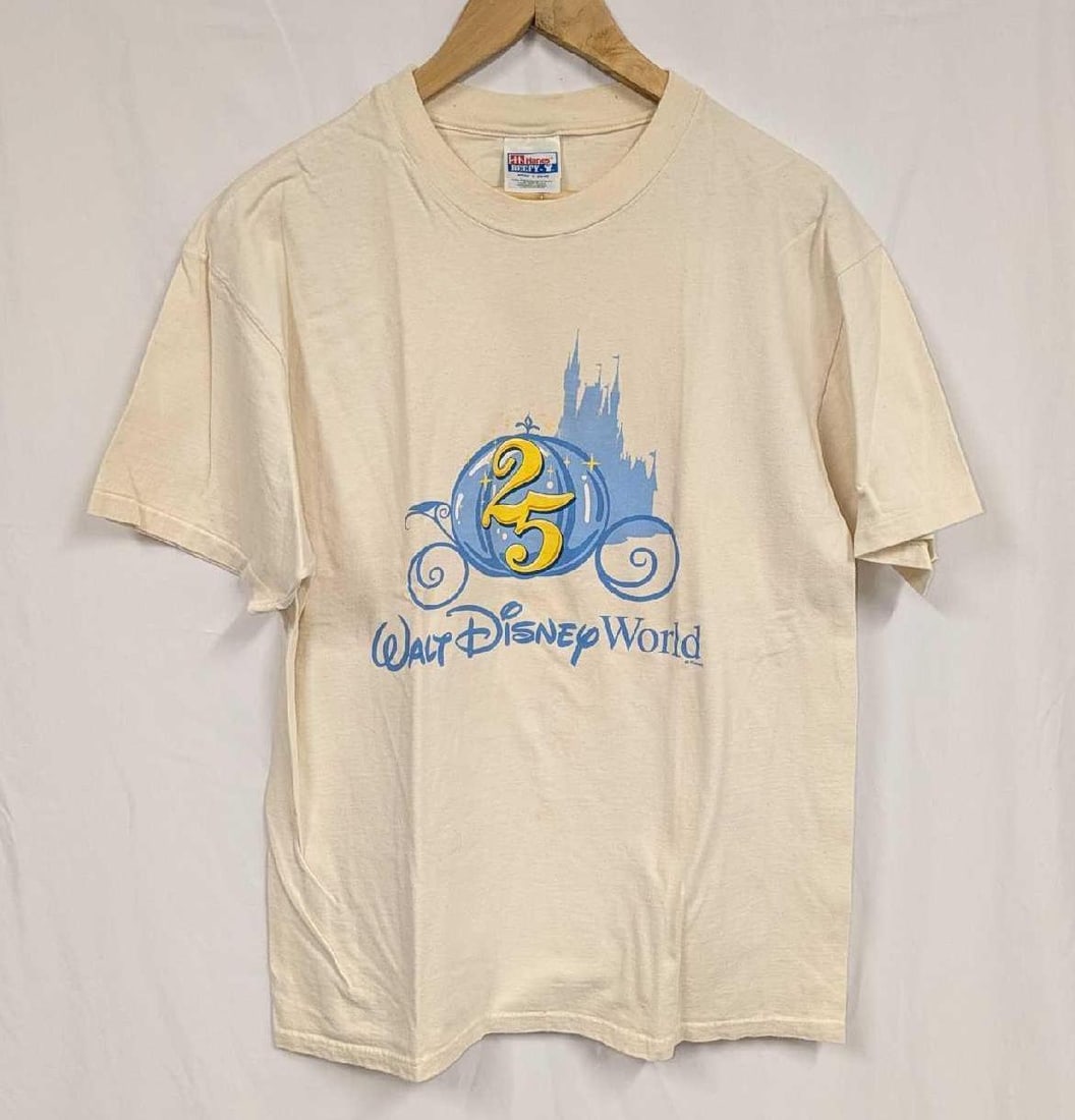 Walt Disney World 25th Anniversary Large T-Shirt: Walt Disney World 25th Anniversary Large T-Shirt. 100% preshrunk cotton. The shirt does not appear to have been worn. There are a couple of small markings on the back and wrinkles due to storage