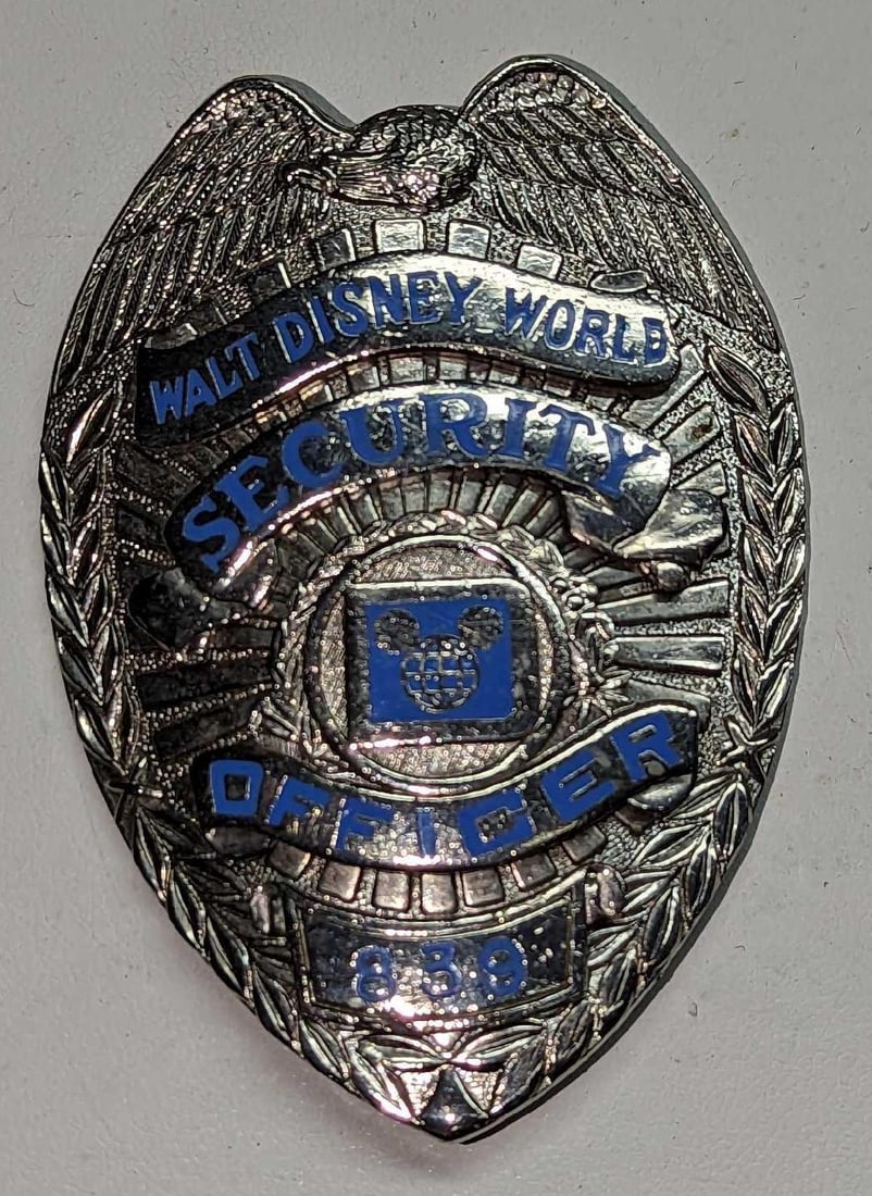 Early 1980s Disney World Security Badge 839: Early 1980s Disney World Security Badge 839. Is approx 2 1/4" x 1/4" x 3 1/4" and it weighs under one pound at 0.16lb. The metal badge is in a good, vintage condition with some wear and small scratche