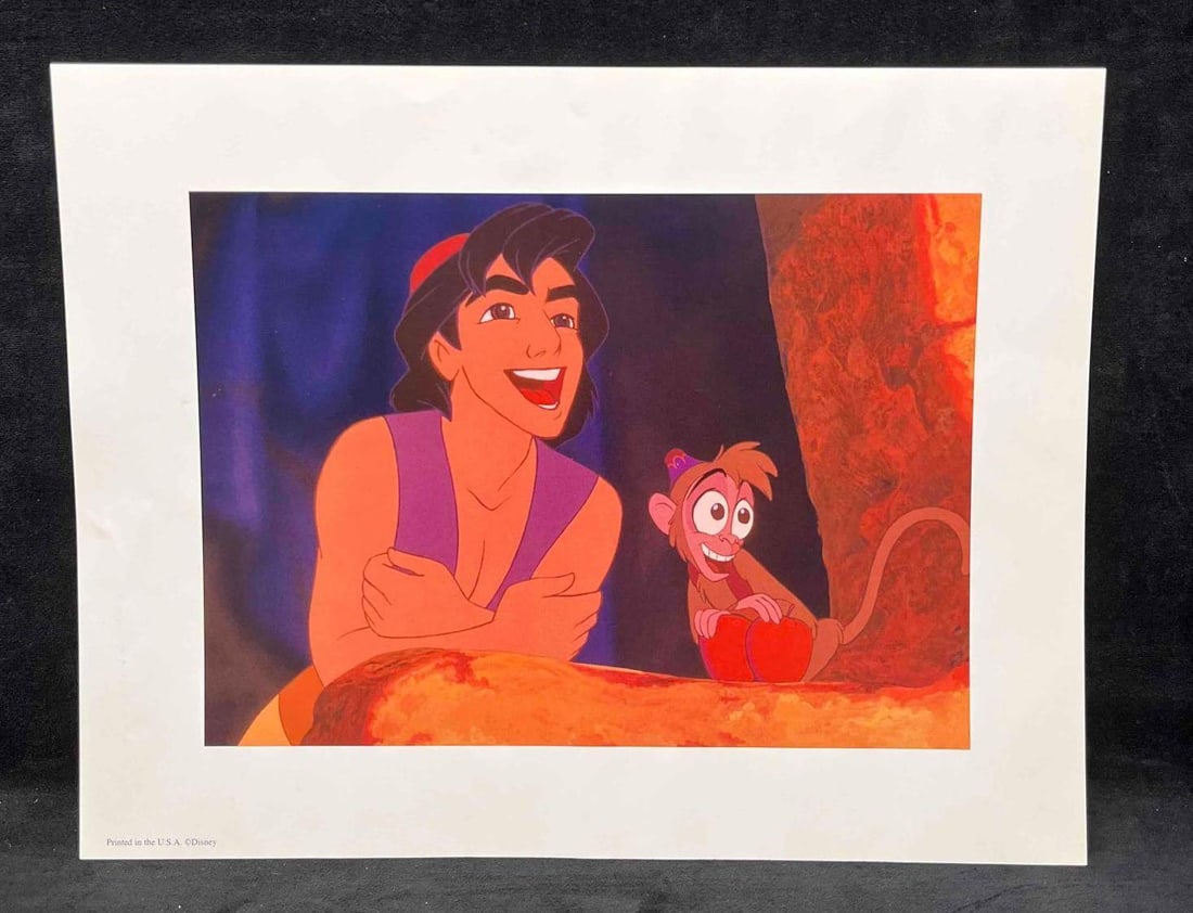 Disney's Aladdin Exclusive Commemorative Lithograph 2004 (C): This lot contains a Disney's Aladdin Exclusive Commemorative Lithograph 2004 (C). This lithograph features Aladdin and Abu. Aladdin is a 1992 Animated musical film produced by Walt Disney Feature