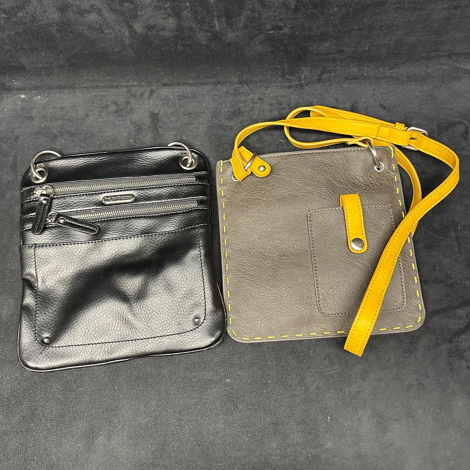 Shiraleah and Tyler Rodan Crossbody Bag Set: Two cross-body bags by brands Tyler Rodan and Shiraleah. Includes a dust bag. These items are in pre-owned, previously displayed condition with light wear and surface scratches. Please reference all