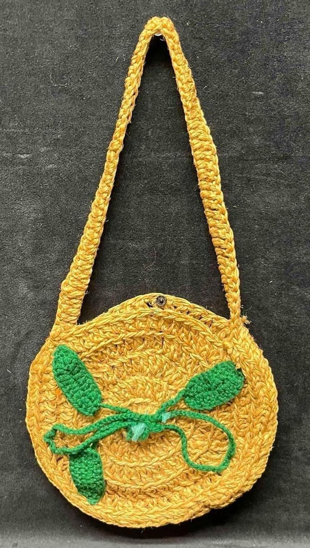 Handmade Small Crochet Bag: This lot contains a Handmade Small Crochet Bag. It is approx. 7" x 7 3/4" x 1". Total weight is approx 2.4oz. Overall the Crochet Bag is in good pre owned condition with minor wear from use over time.