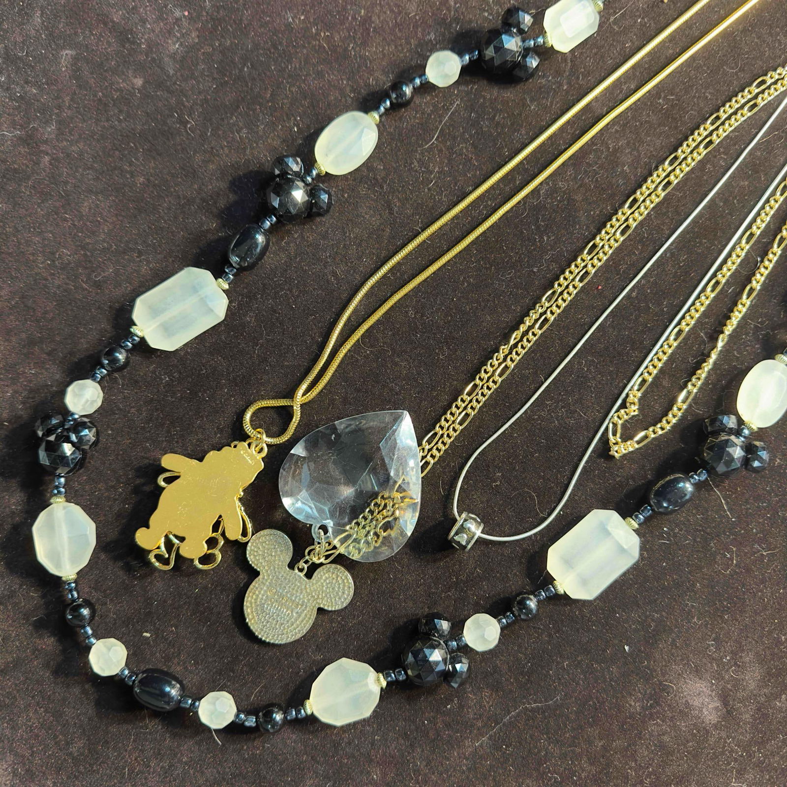 Disney Necklace Collection Lot of Four Necklaces Costume Jewelry Set Winnie The Pooh Mickey: Disney Necklace Collection Lot of Four Necklaces Costume Jewelry Set Winnie The Pooh Mickey. This lot includes four costume jewelry necklaces featuring Disney. The necklaces included are a gold toned