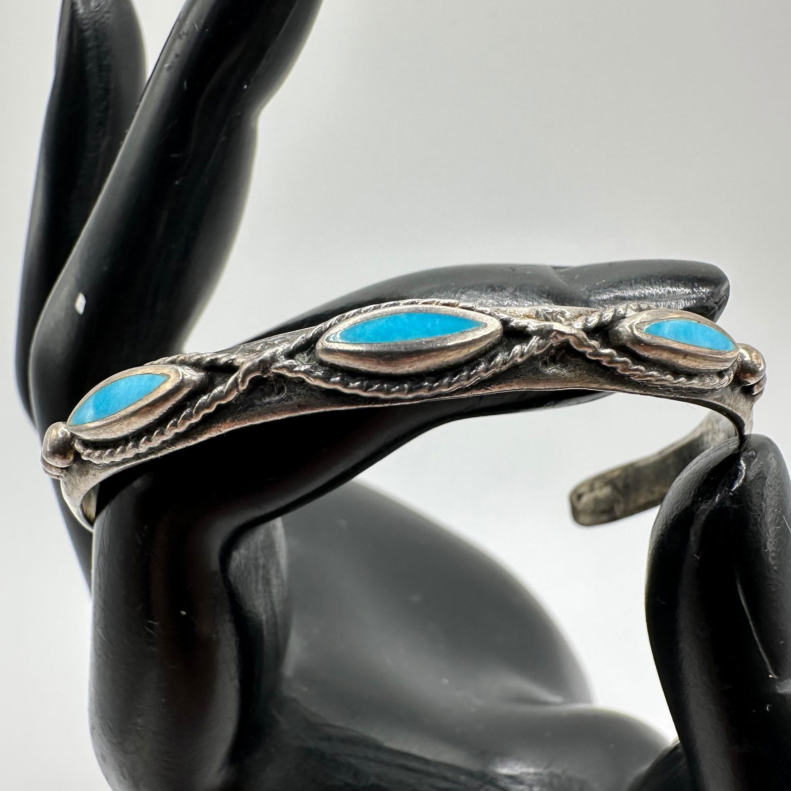 Silver Turquoise Cuff Bracelet Twist Wire Detailing X27: This item is in good pre-owned, previously used/displayed condition with noticeable light wear and surface scratches. Please reference all photos for full details. This piece of jewelry has been teste