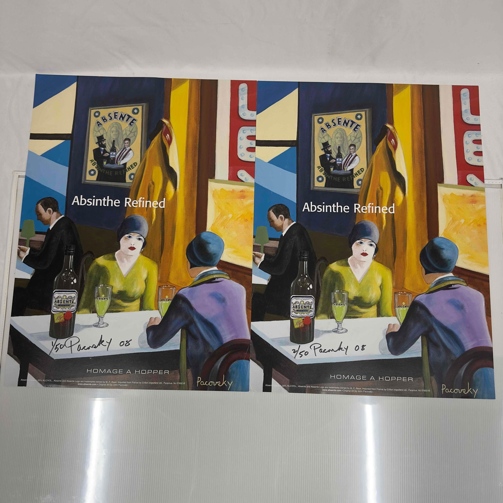 Absinthe Refined Ad Poster Homage A Hopper by John Pacovsky Hand Signed and Numbered Set: Absinthe Refined Ad Poster Homage A Hopper by John Pacovsky Hand Signed and Numbered Set. This set includes two (2) hand signed and numbered posters by John Pacovsky. Limited Edition 50, from 2008. A