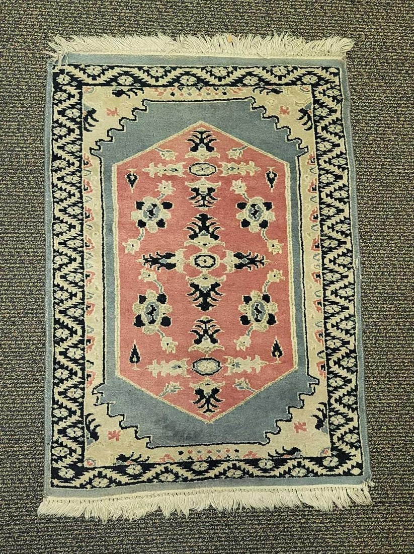 Entrance Prayer Rug: Light weight, unbranded woven rug with white fringe. Aztec trim border. There are pink, blue, black, and tan colors throughout the rug. Approx. measures 3' x 25 1/2", weight is 3lbs.