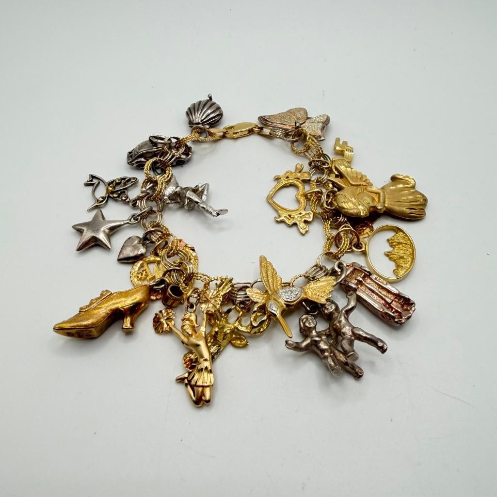 Vintage 14k Gold Charm Bracelet: This piece of jewelry has been tested and researched prior to listing. Please view all our pictures they are part of our description. DETAILS: Metal - 14k Gold, Sterling Silver (some charms)Color -