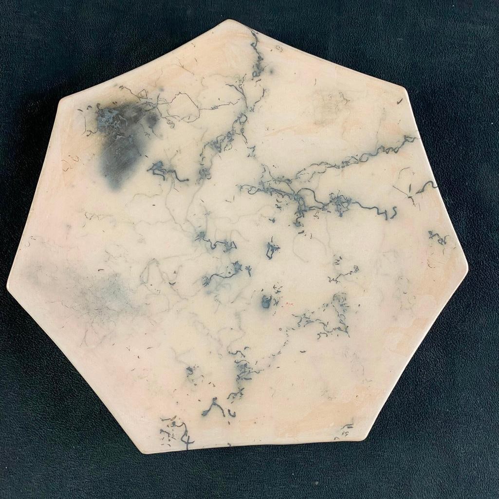 Pink Clay Plate with Black Veins: Pink Clay Plate with Black Veins Heptagonal-shaped pink clay plate, with black veins. This modern decorative plate has a very unique look, and would make a great decorative statement piece. In