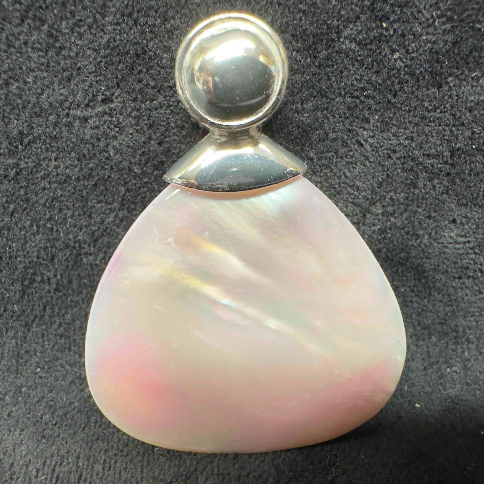 Rage Sterling Silver Mother of Pearl Pink Hue Pendant: This item is in good pre-owned, previously used/displayed condition with noticeable light wear, and surface scratches. Please reference all photos for full details. This piece of jewelry has been