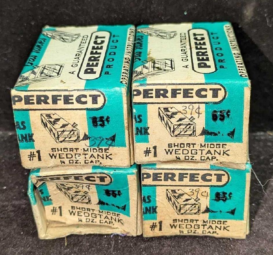 RC Airplane Gas Tank Perfect Product Wedgtank #1: RC Airplane Gas Tank Perfect Product Wedgtank #1. Unused in box. 1/4 oz cap. Each box is approx 2 1/2" x 1 5/8" x 1 1/4". The tanks are approx 1" x 1 1/4" x 1". The tanks have some color loss due to a