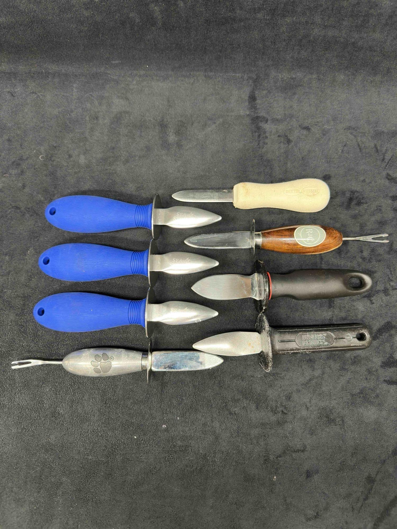 Oyster Knife Stainless Shucker Shucking Shellfish Clams Mussels Lot of Eight 8: Oyster Knife Stainless Shucker Shucking Shellfish Clams Mussels Lot of Eight 8. Various oyster knives by different brands such as Sea Striker, Dexter Russell, Anglers Choice, Etc. Some have wooden or