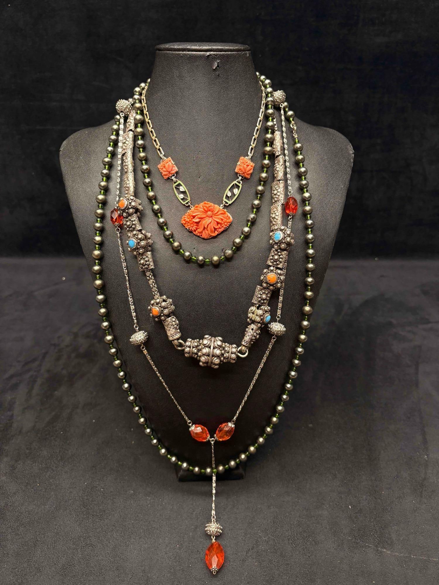 4pc Orange Blue and Silver Tibetan Necklace Lot: This lot consists of 4 pre-owned costume jewelry necklaces with typical wear from use. Please review images for context of the lots visual conditions APPROX. WEIGHT: 14.6 OZ