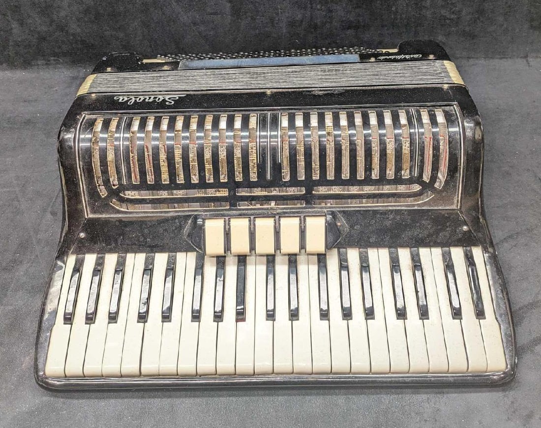 Vintage Sonola Castelfidardo Accordion: Vintage Sonola Castelfidardo Accordion. This is approx 18 1/2" x 7" and it weighs 17.10lbs.Most of the grill covering is missing and open. Please see the images as they are part of the