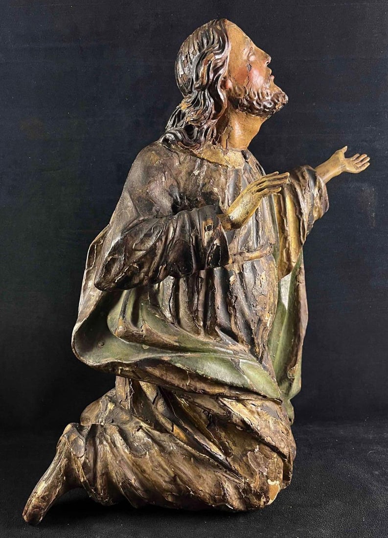 Antique 18th,19th Century Wood Carved Religious Figure: Antique 18th,19th Century Wood Carved Religious Figure Pictured is an antique religious sculpture. The figure kneels looking up to God. The sculpture has colorful layers of paint over called polychro
