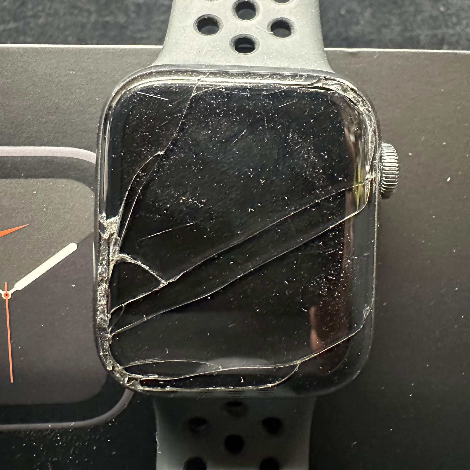 Apple Watch Series 5 Nike 44mm Broken Needs Repair: Apple Watch Series 5 Nike edition with a broken screen. The watch powers on, but is in need of repair. Includes original box and band. No charger. Offering for parts or repair. These items are in