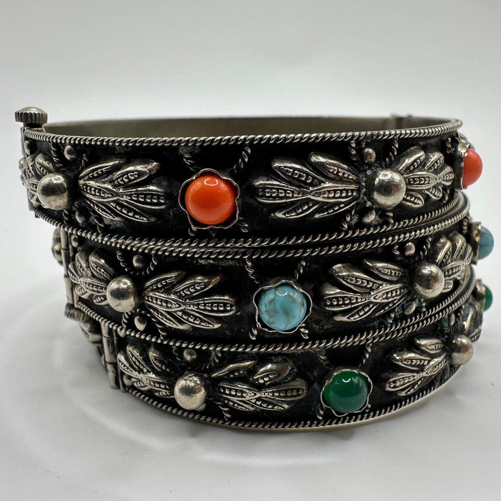 Group of Three Vintage Alp Italy Alpaca Nickel Base Metal Jewelry Cuff Bracelets: The lot includes three vintage costume jewelry cuff bracelets. All are marked Alp Italy with a pink cabochon and leaf detail; one marked Made in Italy ALP with faux stone cabochon accents. All pieces