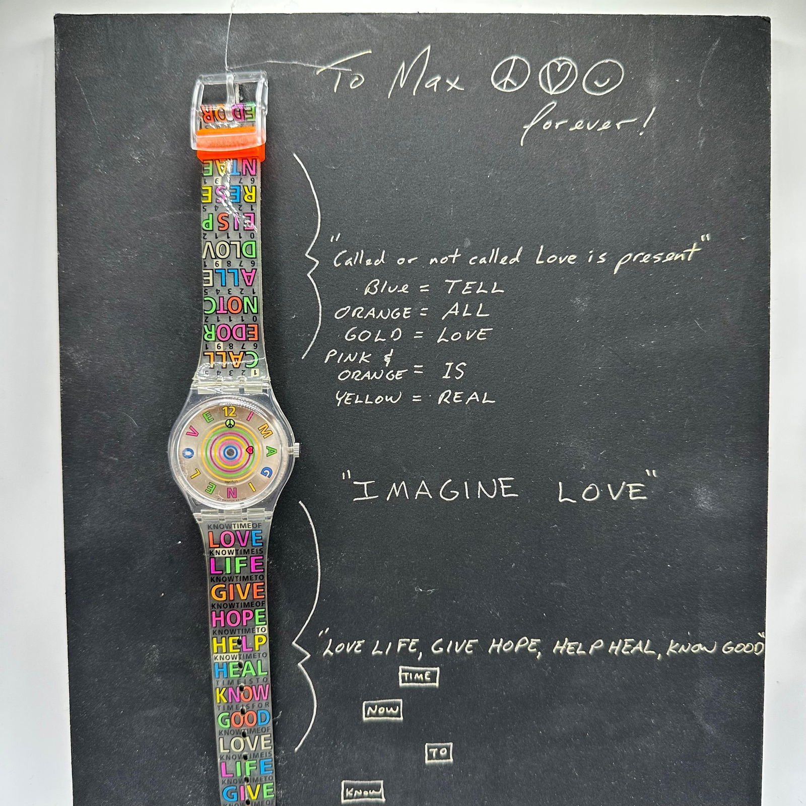 Signed Alex Echo Imagine Love Swatch Watch Mock-Up Board #1: Concept presentation board for the “Imagine Love” Swatch watch, designed by contemporary artist and designer Alex Echo. The board displays a Swatch watch mounted to a chalkboard-style