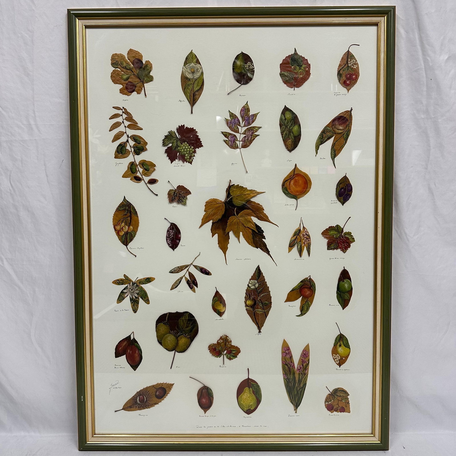 Large Framed Mixed Media Botanical Artwork by Johanne Olivain Painted Floral and Fruit on Natural: Beautiful mixed media artwork featuring thirty-three individually painted mountain flowers, fruit, floral, and botanicals, each rendered on a real dried natural leaf. Signed Johanne O. on the front an
