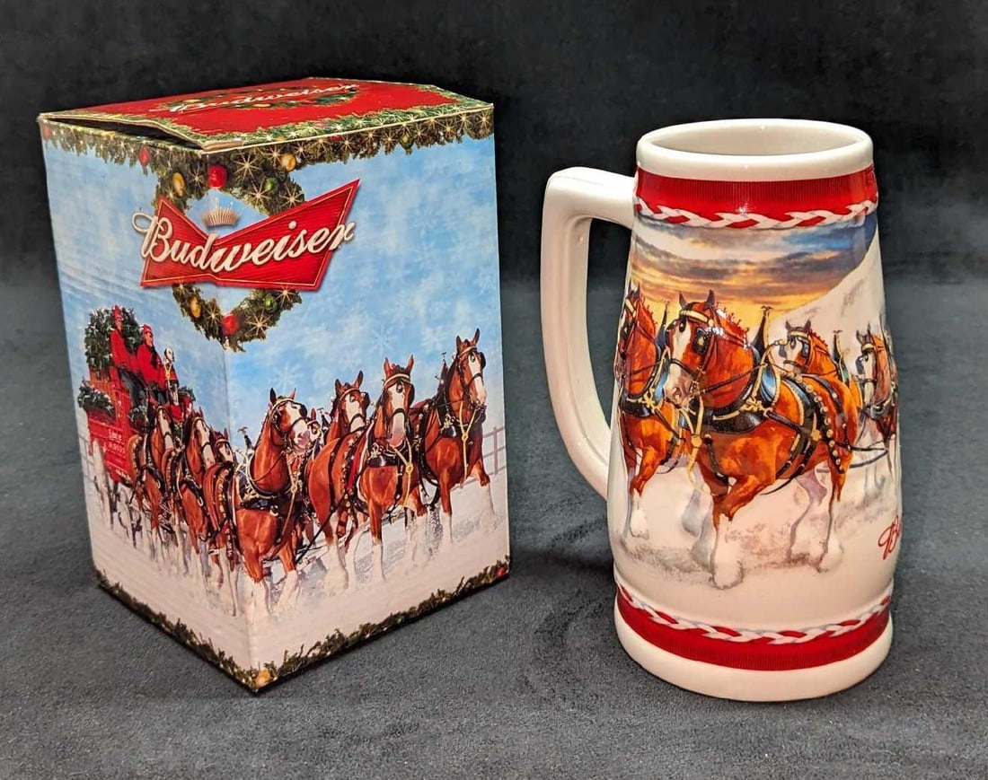 2010 Budweiser Dashing Through The Snow Stein: 2010 Budweiser Dashing Through The Snow Stein. This ceramic stein is approx 5 1/2" x 4" x 7 1/4". It comes in the original box which is approx 4 5/8" x 4 3/4" x 7 1/2" and it weighs 1.83lb. The box