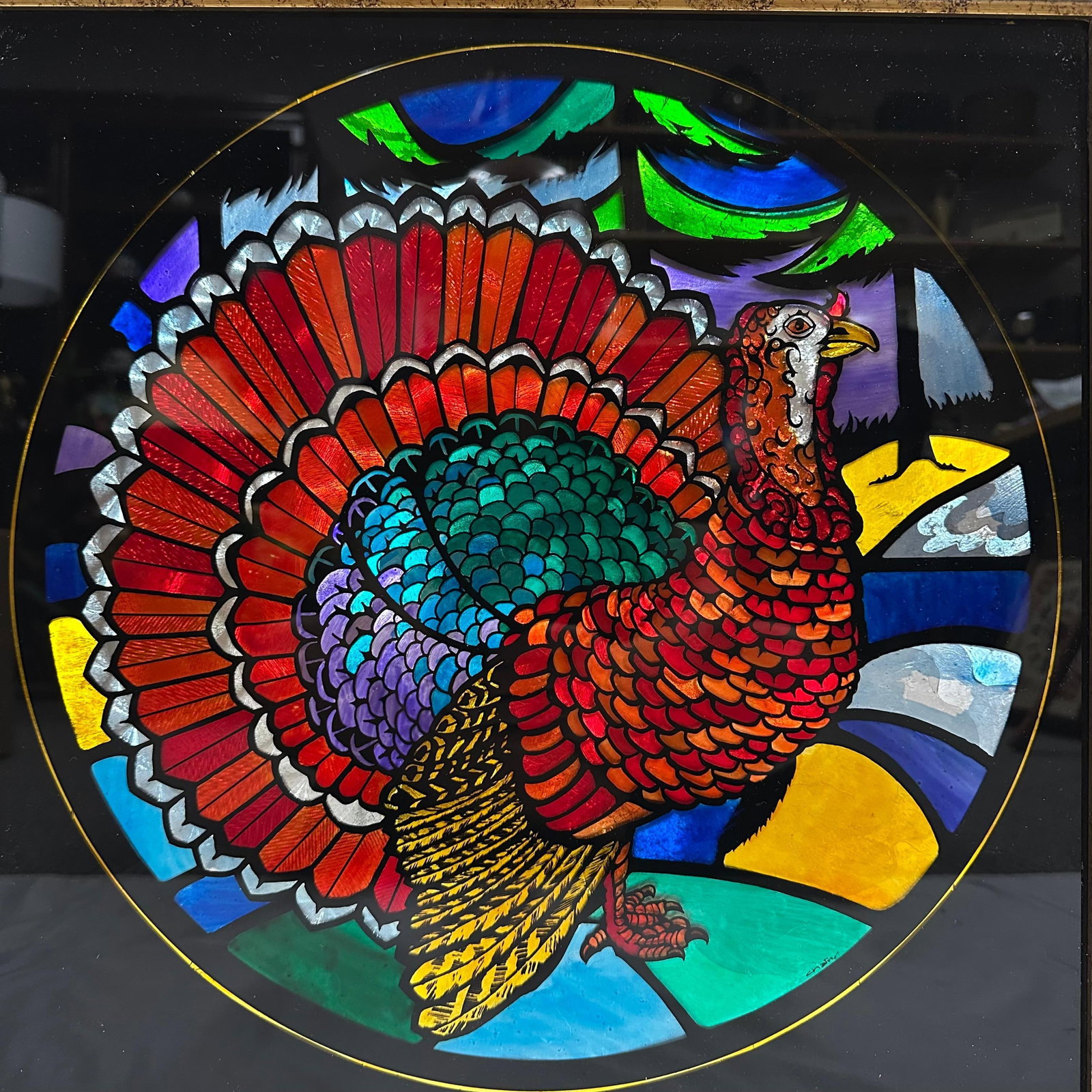 Framed Stained Glass Turkey Panel Colorful Leaded Glass Artwork: Vibrant stained glass panel depicting a turkey in full display, set in a gold-tone frame. Strong color tones throughout with textured and iridescent (foil) glass elements. This item is in pre-owned, p