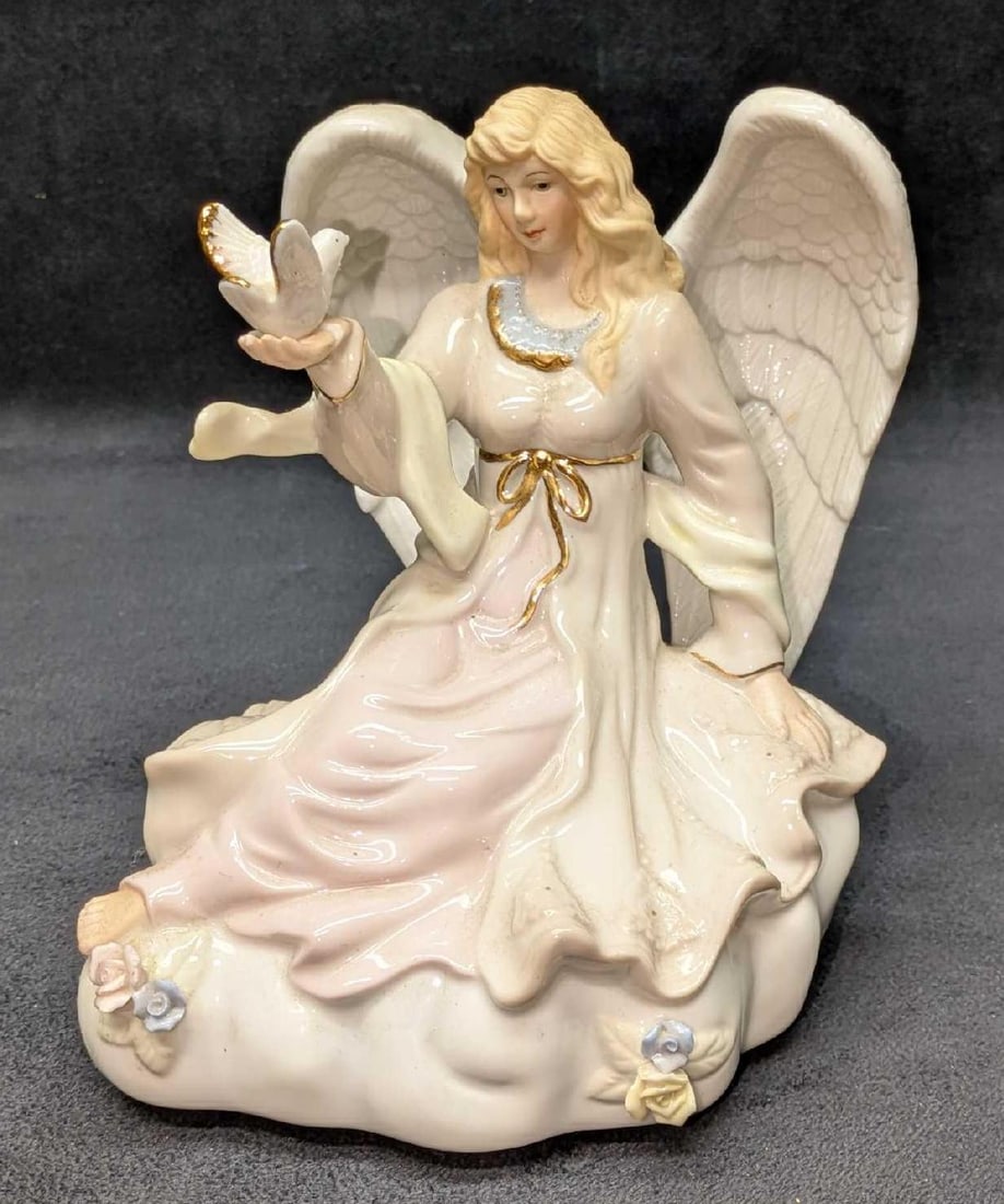 Classic Treasures Porcelain Angel With Dove Music Box: Classic Treasures Porcelain Angel With Dove Music Box. Plays the "Lord's Prayer". This is approx 6 1/2" x 5 1/2" x 6" and it weighs 1.52lb. The music box was tested and it works. The music box has som