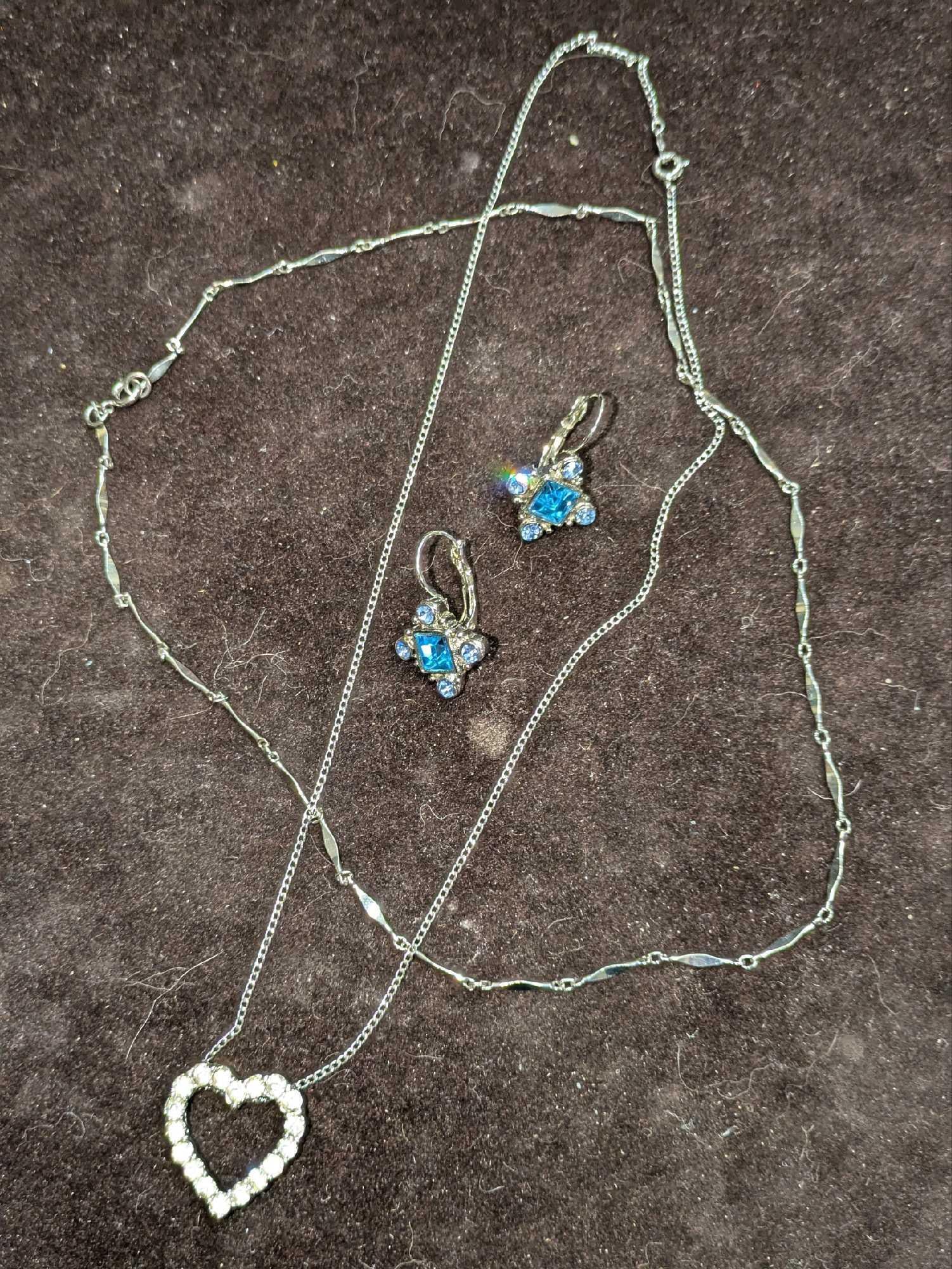 2 Silver Plated Necklaces And One Clip On Earring: 2 Silver Plated Necklaces And One Clip On Earring. This lot includes: (1) Silver Plate & Rhinestone Necklace. This is approx 17 1/2". (1) Silver Plate Wave Bar Necklace. This is approx 18"